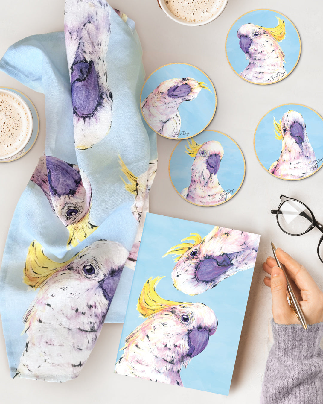 Australian Cockatoo gift bundle featuring matching coasters, notebook, greeting card and Australian-made linen tea towel with original artwork by Shannon Dwyer